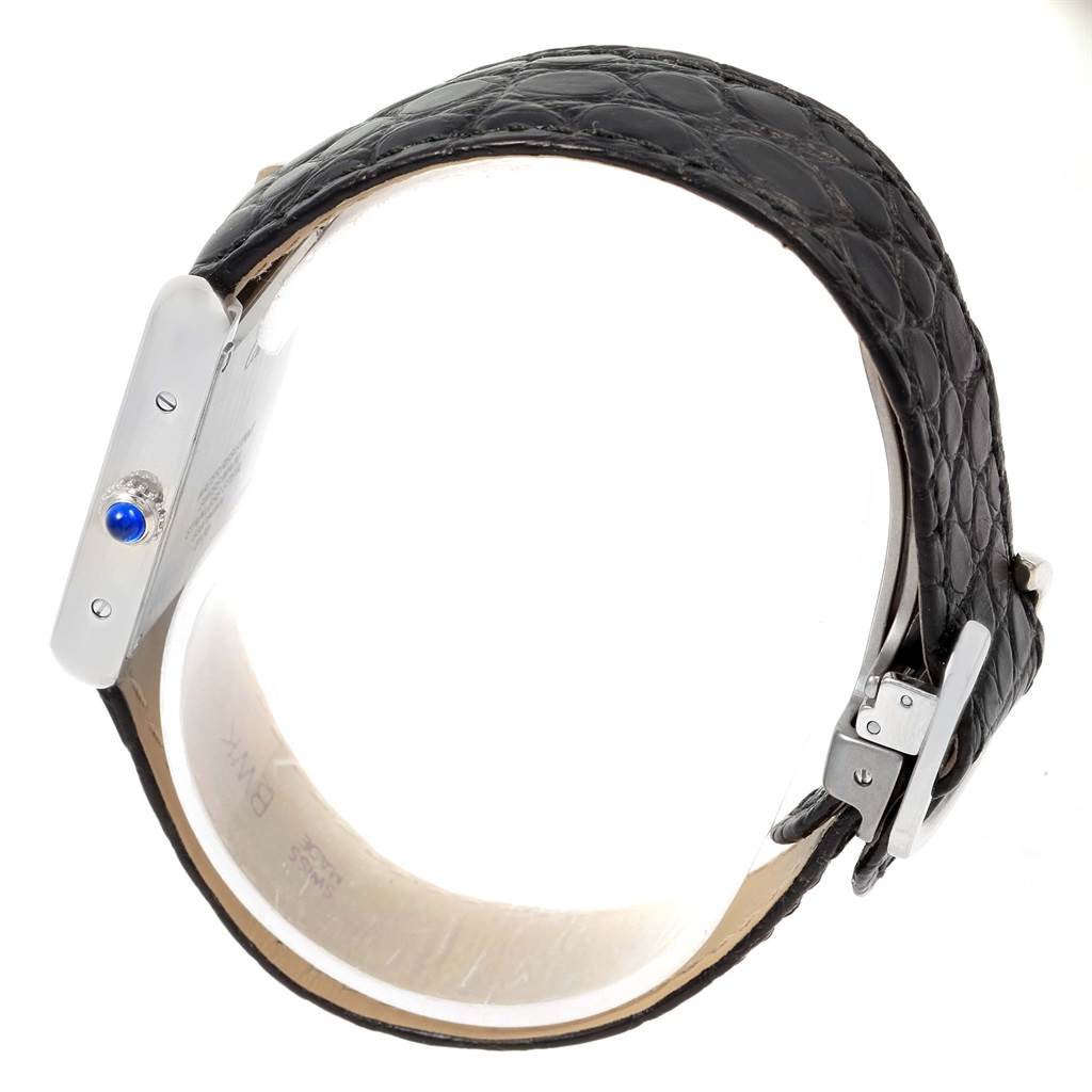 The image shows a side view of the Cartier Tank Solo W1018255 Women's Stainless Steel Silver Dial W1018255 Women's Stainless Steel Silver Dial watch, highlighting the crown, case, black leather strap, and buckle.