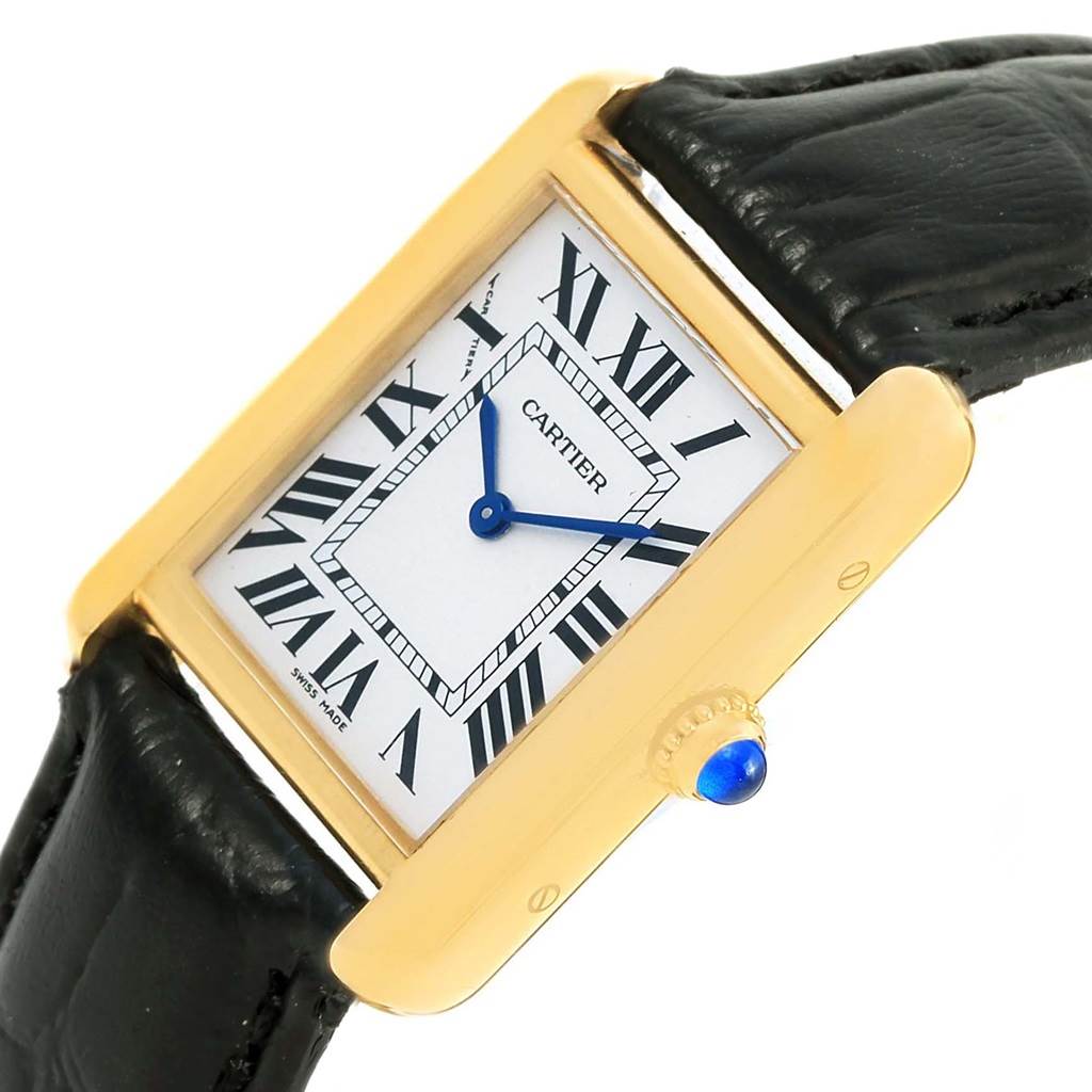 This image shows a close-up angle of the Cartier Tank Solo W1018755 Women's Steel and Gold (two tone) Silver Dial W1018755 Women's Steel and Gold (two tone) Silver Dial's face, crown, and part of its black leather strap.