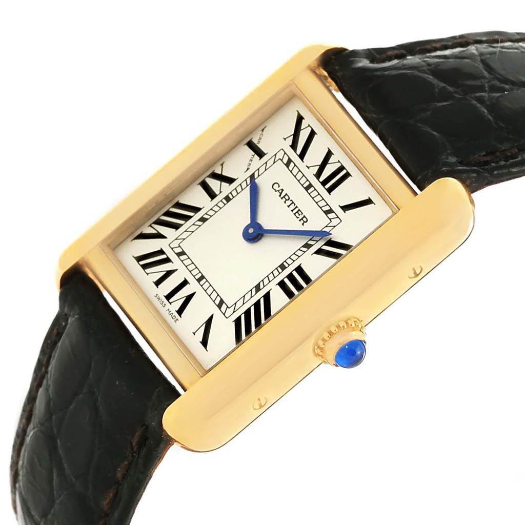 The Cartier Tank Solo W1018755 Women's Steel and Gold (two tone) Silver Dial W1018755 Women's Steel and Gold (two tone) Silver Dial watch is shown at an angle, highlighting its rectangular face, Roman numerals, blue hands, and black leather strap.