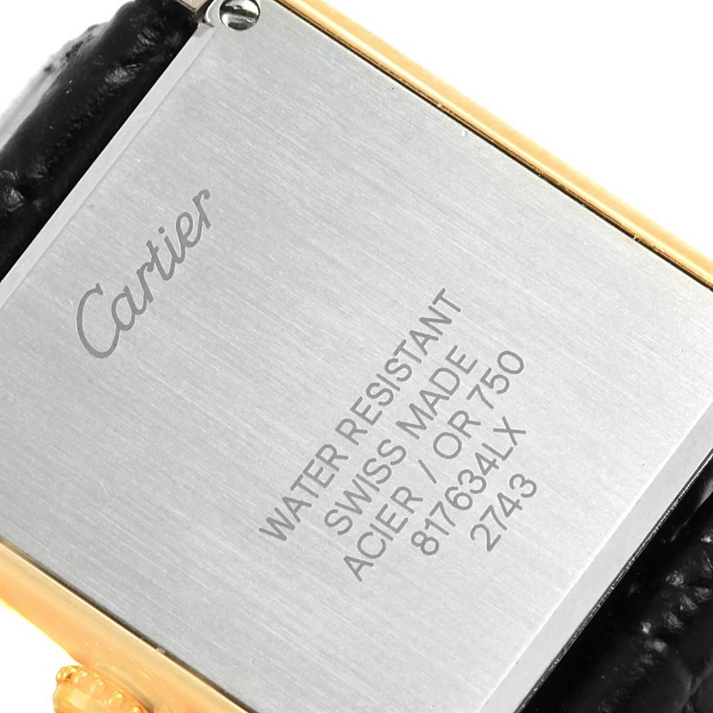 This is a close-up of the case back for the Cartier Tank Solo W1018755 Women's Steel and Gold (two tone) Silver Dial W1018755 Women's Steel and Gold (two tone) Silver Dial watch, showing the model's engraving and leather strap attachment.