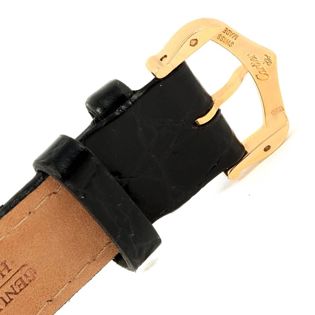 The image shows a close-up of the black leather strap and gold buckle of a Cartier Tank Solo W1018755 Women's Steel and Gold (two tone) Silver Dial W1018755 Women's Steel and Gold (two tone) Silver Dial watch.