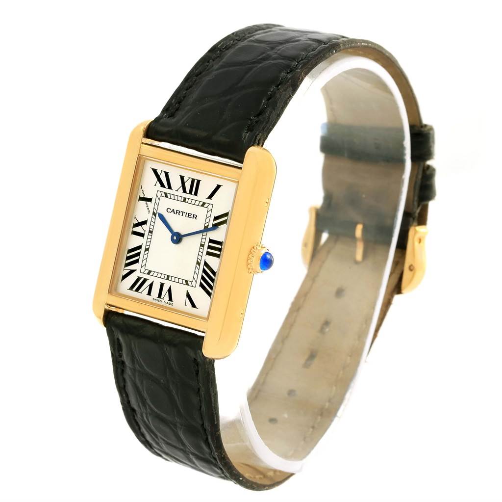 The Cartier Tank Solo W1018755 Women's Steel and Gold (two tone) Silver Dial W1018755 Women's Steel and Gold (two tone) Silver Dial watch is shown at an angle highlighting its rectangular face, Roman numerals, and black leather strap.