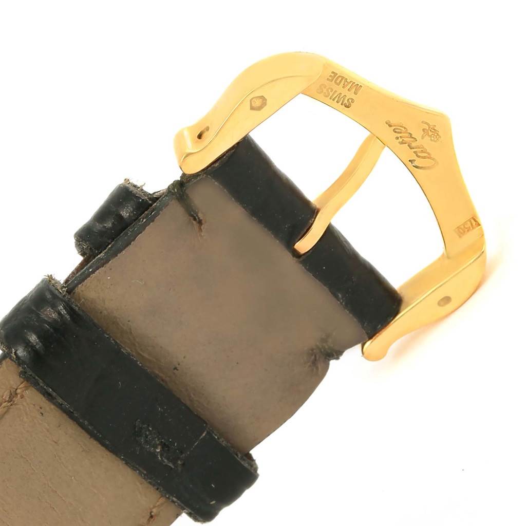 This image shows a detailed close-up of the gold buckle and leather strap of a Cartier Tank Solo W1018755 Women's Steel and Gold (two tone) Silver Dial W1018755 Women's Steel and Gold (two tone) Silver Dial watch.