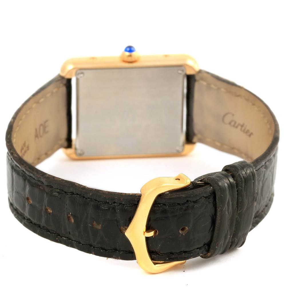 The image shows the back view of a Cartier Tank Solo W1018755 Women's Steel and Gold (two tone) Silver Dial W1018755 Women's Steel and Gold (two tone) Silver Dial watch, highlighting its strap, buckle, and case back.