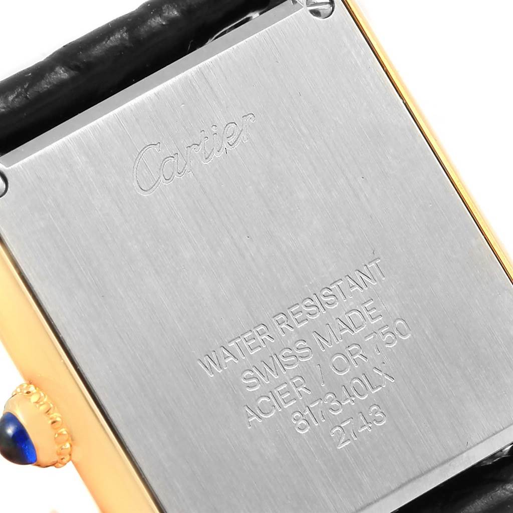 This image shows the back case of a Cartier Tank Solo W1018755 Women's Steel and Gold (two tone) Silver Dial W1018755 Women's Steel and Gold (two tone) Silver Dial watch, displaying branding, water resistance details, and model information.