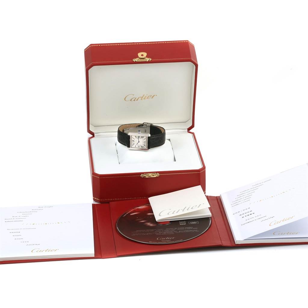 The image shows a Cartier Tank Solo W1018255 Women's Stainless Steel Silver Dial W1018255 Women's Stainless Steel Silver Dial watch inside its red box, along with accompanying documentation and a CD.