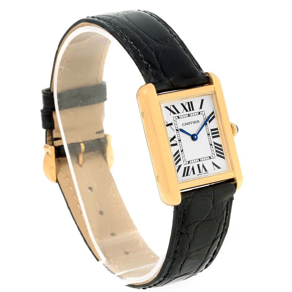The Cartier Tank Solo W1018755 Women's Steel and Gold (two tone) Silver Dial W1018755 Women's Steel and Gold (two tone) Silver Dial watch is shown at a three-quarter angle, highlighting its rectangular face, Roman numeral dial, and black leather strap.