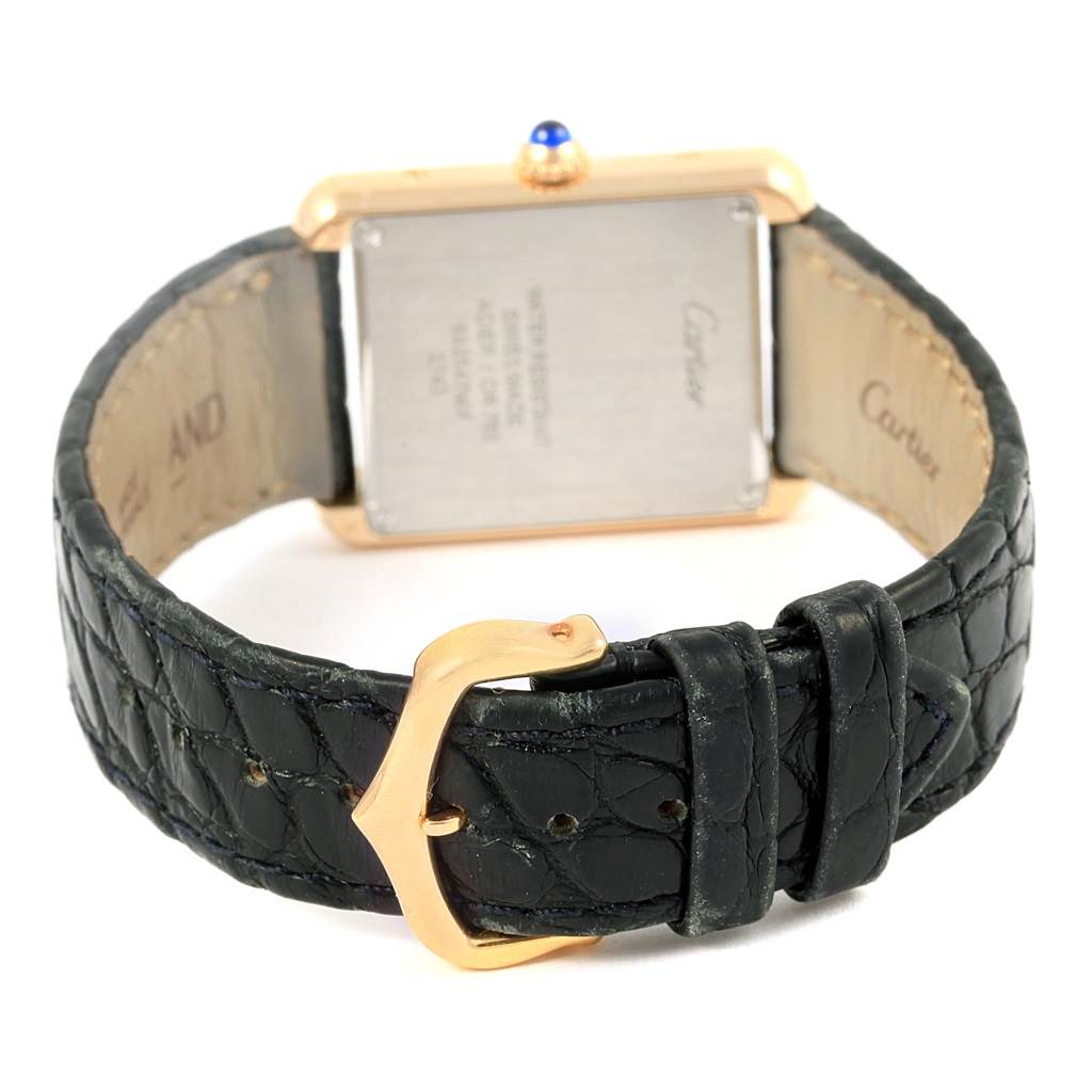 The image shows the back view of a Cartier Tank Solo W1018755 Women's Steel and Gold (two tone) Silver Dial W1018755 Women's Steel and Gold (two tone) Silver Dial watch focusing on the clasp, strap, and case back.