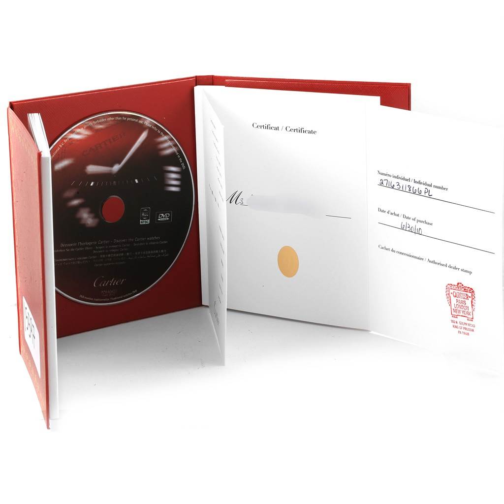 The image shows documents and a DVD in a red folder for the Cartier Tank Solo W1019455 Women's Stainless Steel Orange Dial W1019455 Women's Stainless Steel Orange Dial watch model.