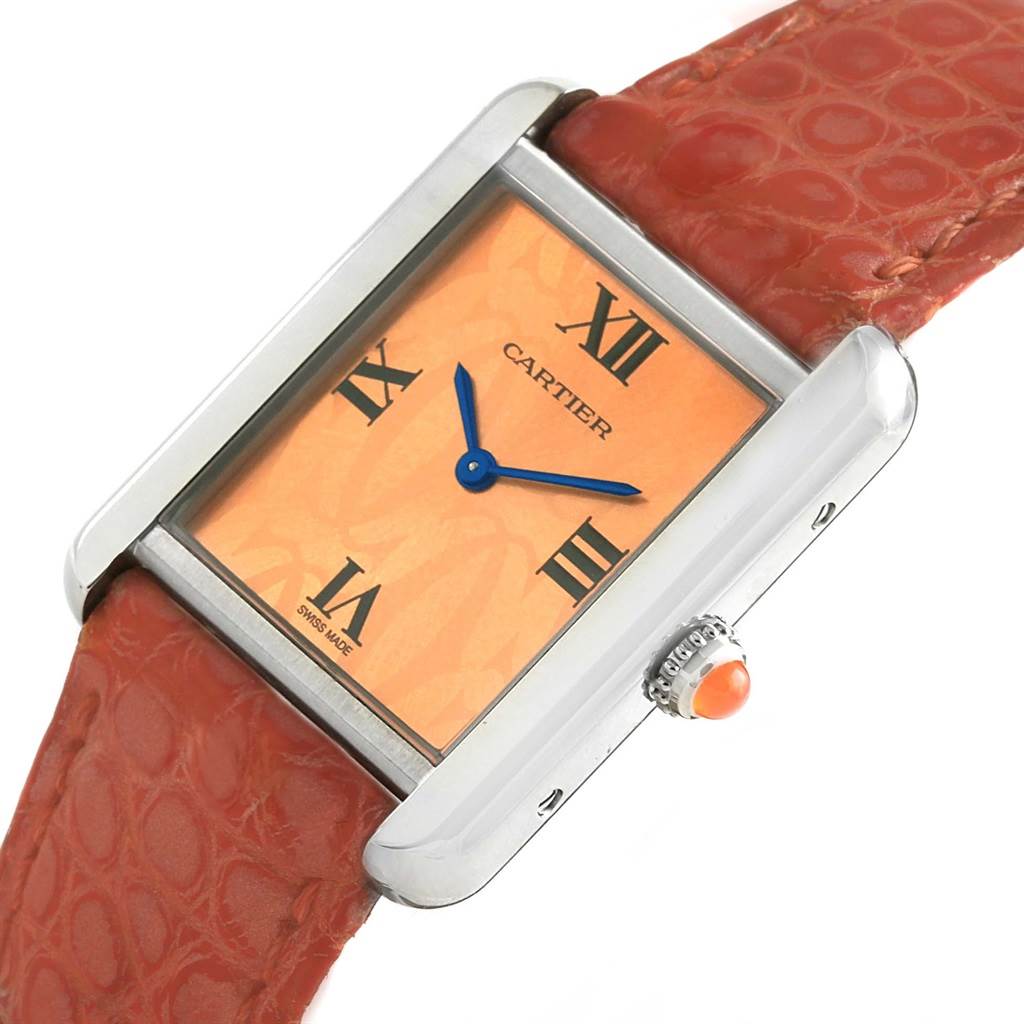 This image shows a Cartier Tank Solo W1019455 Women's Stainless Steel Orange Dial W1019455 Women's Stainless Steel Orange Dial watch at an angled close-up, highlighting its face, crown, and a portion of the strap.