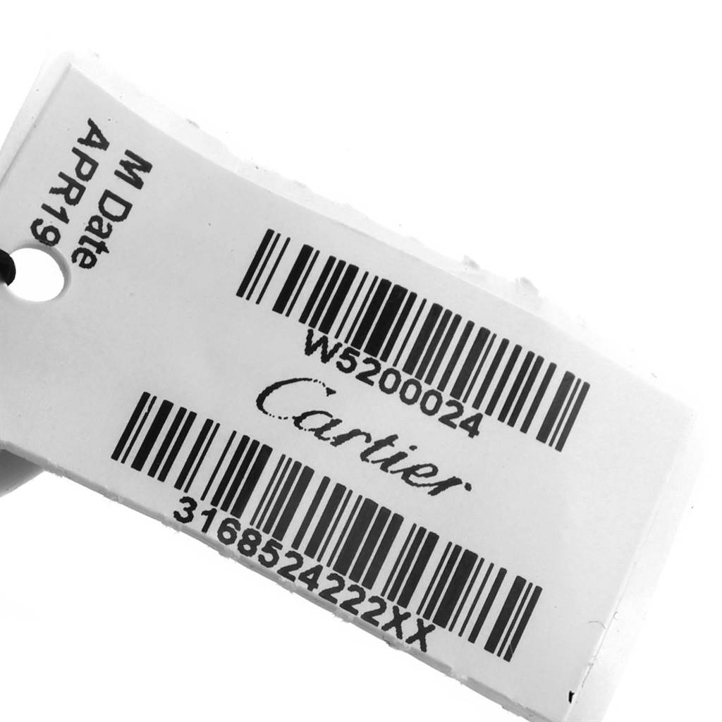 The image shows a Cartier Tank Solo W5200024 Women's Steel and Gold (two tone) Silver Dial W5200024 Women's Steel and Gold (two tone) Silver Dial watch tag with barcodes and product details.