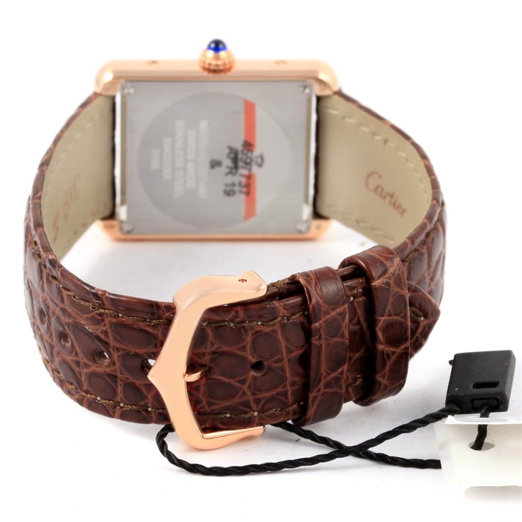 The image shows the back view of a Cartier Tank Solo W5200024 Women's Steel and Gold (two tone) Silver Dial W5200024 Women's Steel and Gold (two tone) Silver Dial watch, highlighting the brown leather strap and clasp.