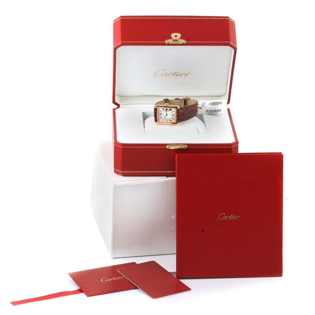 The Cartier Tank Solo W5200024 Women's Steel and Gold (two tone) Silver Dial W5200024 Women's Steel and Gold (two tone) Silver Dial watch is displayed in its open red box with packaging and papers visible.