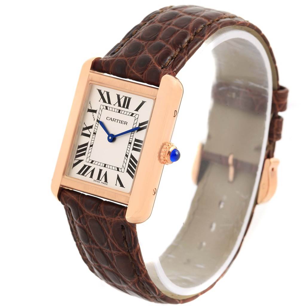 The Cartier Tank Solo W5200024 Women's Steel and Gold (two tone) Silver Dial W5200024 Women's Steel and Gold (two tone) Silver Dial watch is shown at an angled side view, highlighting its Roman numeral dial, rectangular case, and leather strap.