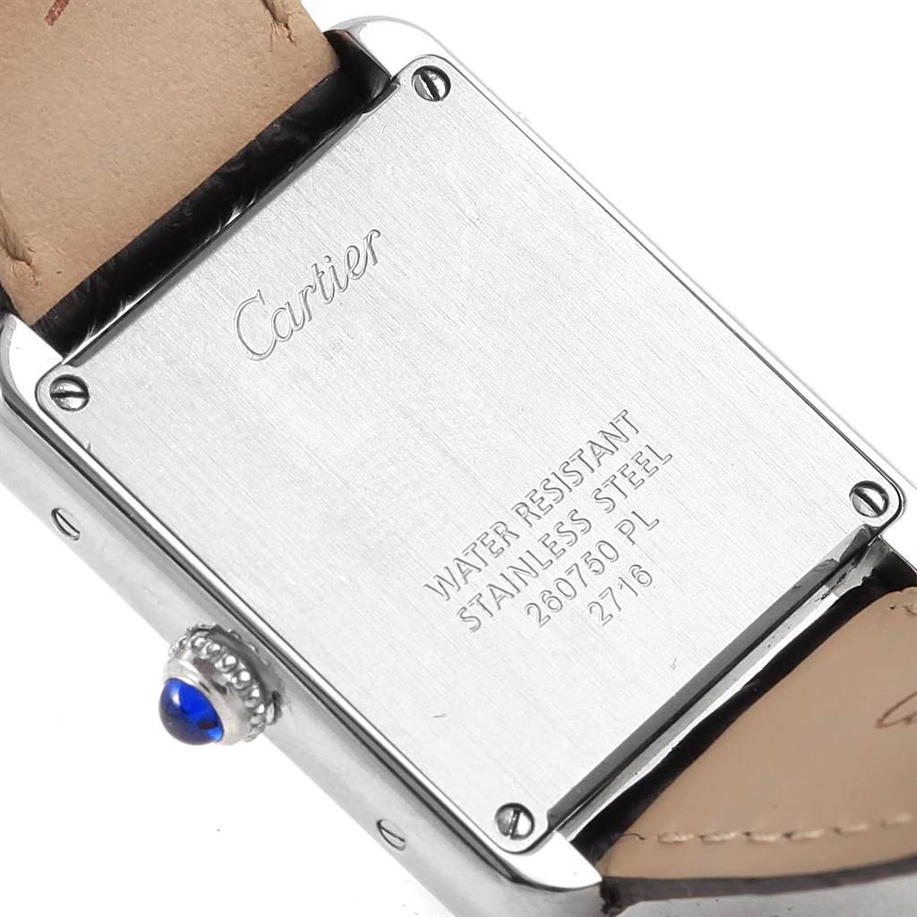 The image shows the back case and part of the strap of a Cartier Tank Solo W1018255 Women's Stainless Steel Silver Dial W1018255 Women's Stainless Steel Silver Dial watch, including engravings and the blue cabochon crown.
