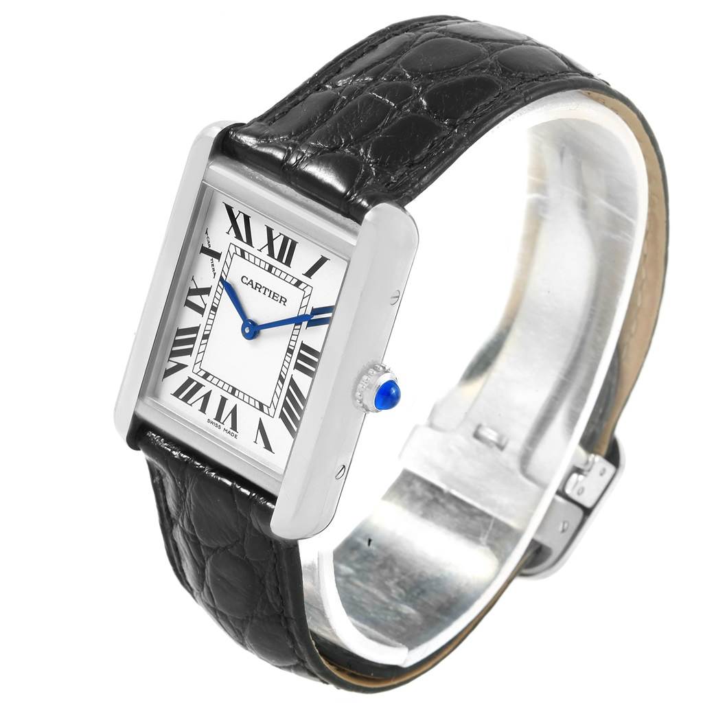 The image shows a Cartier Tank Solo W1018255 Women's Stainless Steel Silver Dial W1018255 Women's Stainless Steel Silver Dial watch at an angled view, highlighting the face, black leather strap, and crown with a blue cabochon.