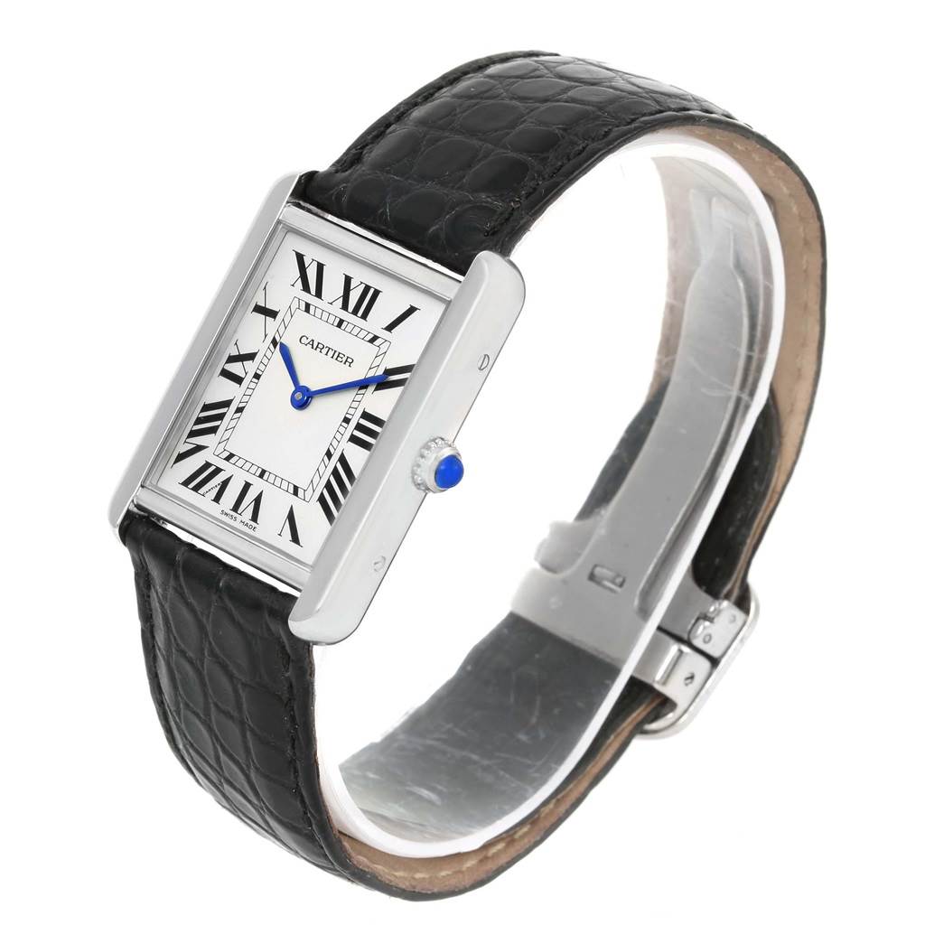 The Cartier Tank Solo W1018355 Stainless Steel Silver Dial W1018355 Stainless Steel Silver Dial watch is shown at a slight angle, displaying the rectangular face, Roman numerals, blue hands, and black leather strap.