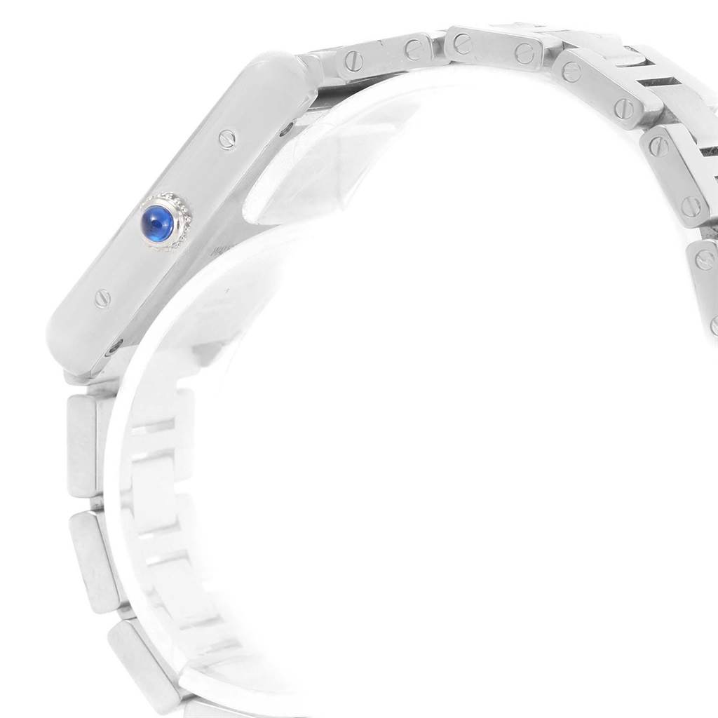 A side view of the Cartier Tank Solo W5200013 Women's Stainless Steel Silver Dial W5200013 Women's Stainless Steel Silver Dial watch showing the crown with a blue cabochon and part of the metal bracelet.