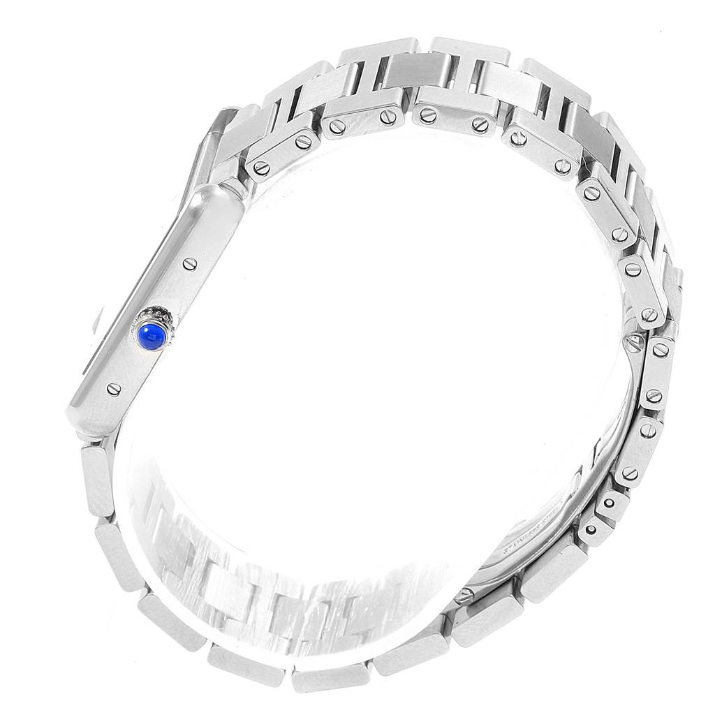The image shows a side view of the Cartier Tank Solo W5200013 Women's Stainless Steel Silver Dial W5200013 Women's Stainless Steel Silver Dial watch with its metal bracelet and crown with a blue cabochon.