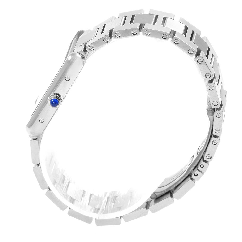 The image shows a side view of the Cartier Tank Solo W5200013 Women
s Stainless Steel Silver Dial W5200013 Women
s Stainless Steel Silver Dial watch, highlighting its metal bracelet and crown with a blue cabochon.