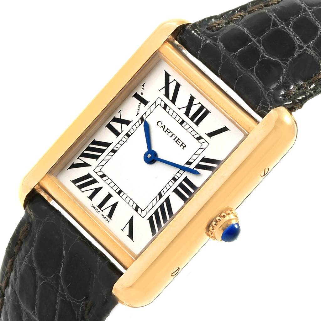 The image shows a close-up angle of the Cartier Tank Solo W1018755 Women's Steel and Gold (two tone) Silver Dial W1018755 Women's Steel and Gold (two tone) Silver Dial watch, highlighting its face, crown, and part of the black leather strap.