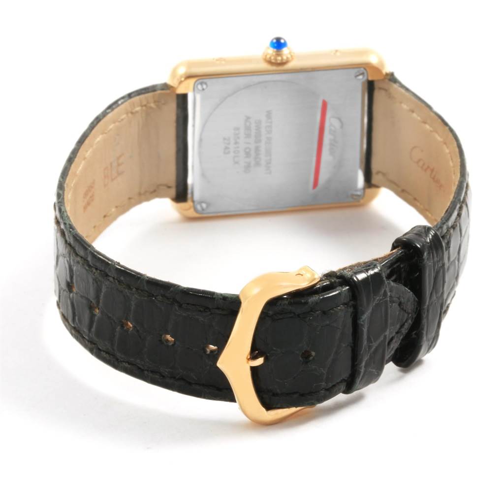 The Cartier Tank Solo W1018755 Women's Steel and Gold (two tone) Silver Dial W1018755 Women's Steel and Gold (two tone) Silver Dial watch is shown from the back, displaying the case, crown, and leather strap with a gold buckle.