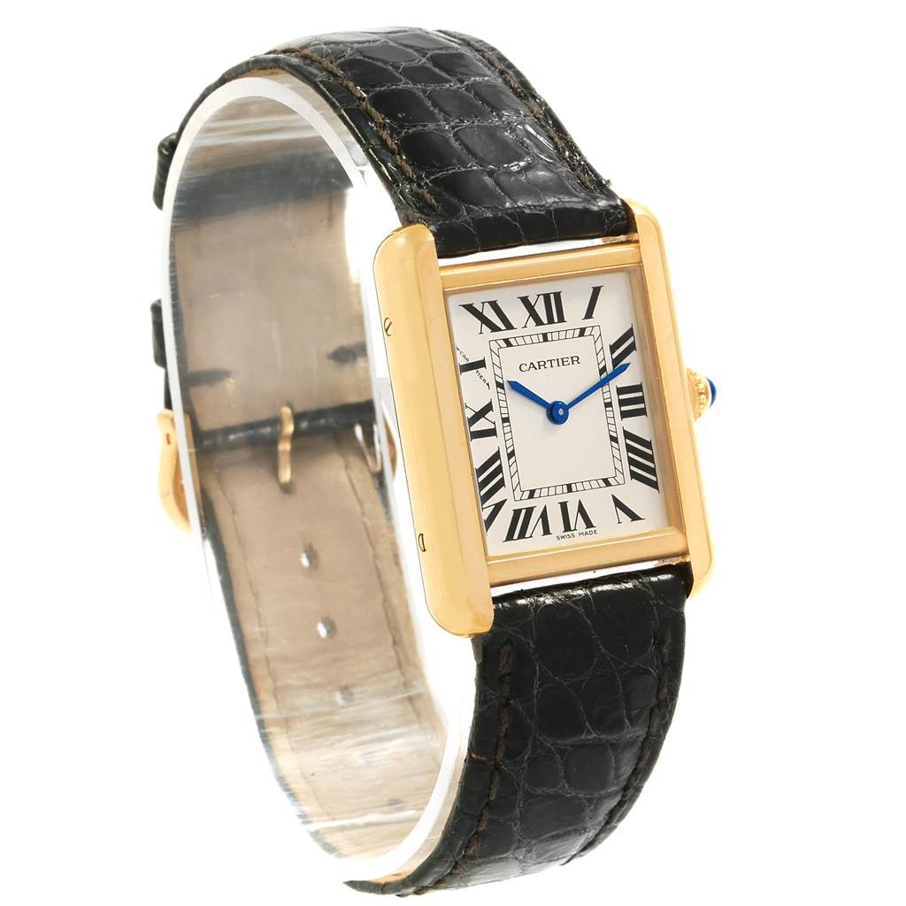 The image shows a Cartier Tank Solo W1018755 Women's Steel and Gold (two tone) Silver Dial W1018755 Women's Steel and Gold (two tone) Silver Dial watch from a front-side angle, displaying its rectangular dial, Roman numerals, and black leather strap.