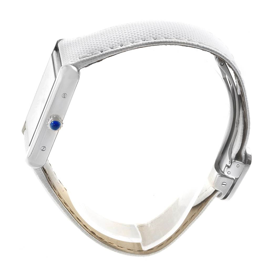 This image shows a side view of the Cartier Tank Solo W1018255 Women's Stainless Steel Silver Dial W1018255 Women's Stainless Steel Silver Dial watch, displaying its white strap, case, and blue crown.