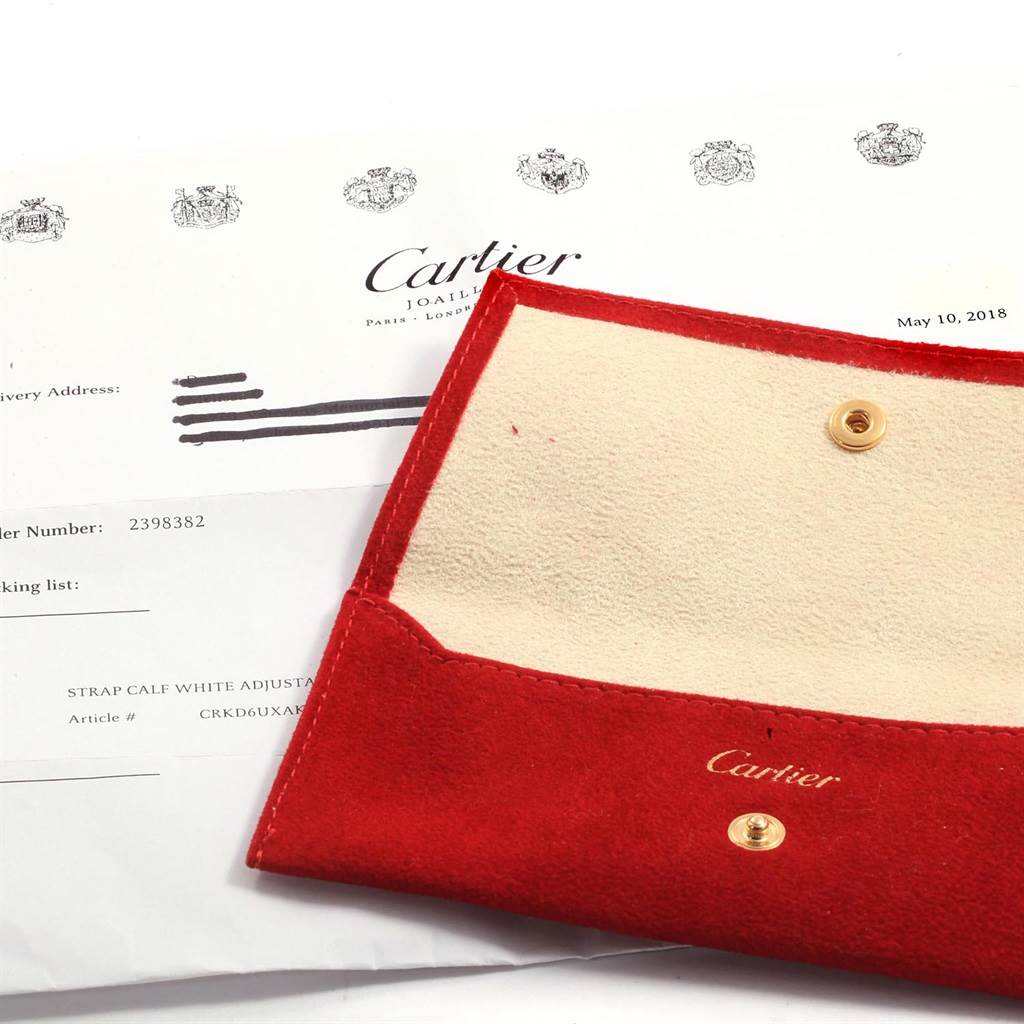 This image shows a red Cartier pouch and official documents for the Cartier Tank Solo W1018255 Women's Stainless Steel Silver Dial W1018255 Women's Stainless Steel Silver Dial watch model.