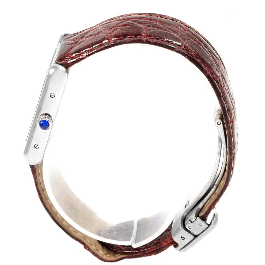 This image shows the Cartier Tank Solo 19908 Women
s Stainless Steel Silver Dial 19908 Women
s Stainless Steel Silver Dial watch from a side angle, highlighting the crown and part of the leather strap.