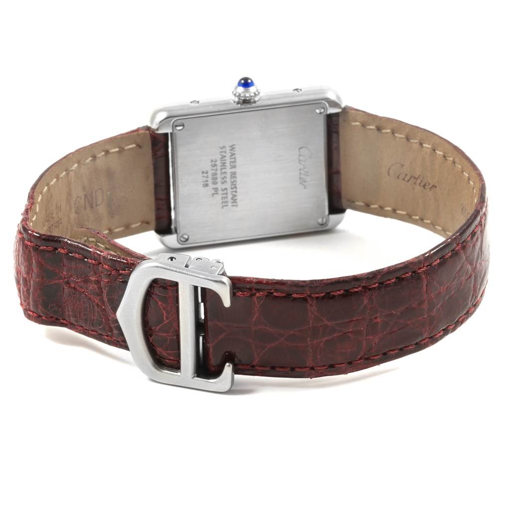 The image shows the back view of a Cartier Tank Solo 19908 Women
s Stainless Steel Silver Dial 19908 Women
s Stainless Steel Silver Dial watch, highlighting its straps, buckle, and case back.