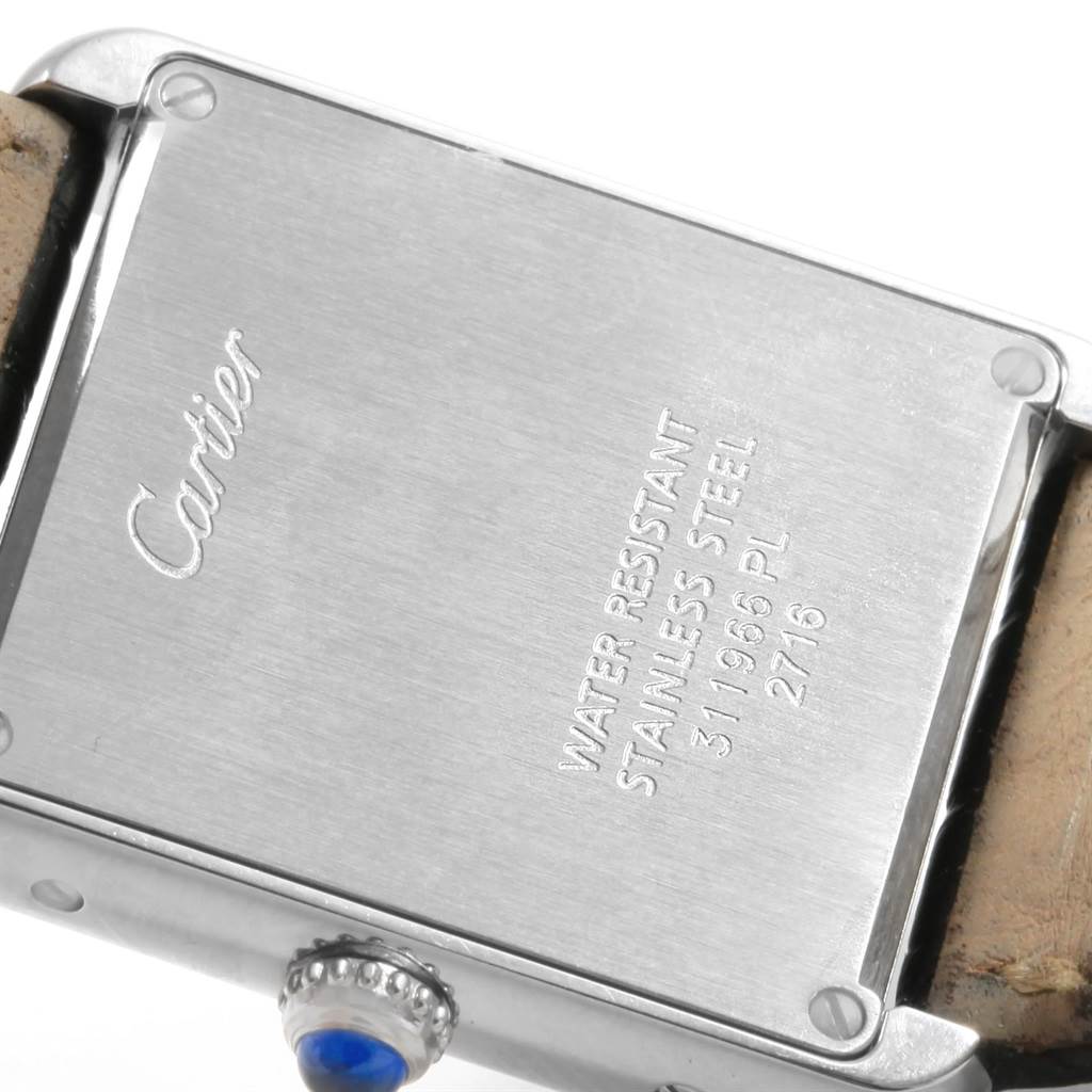 The image shows the back case and crown of a Cartier Tank Solo W1018255 Women's Stainless Steel Silver Dial W1018255 Women's Stainless Steel Silver Dial watch.