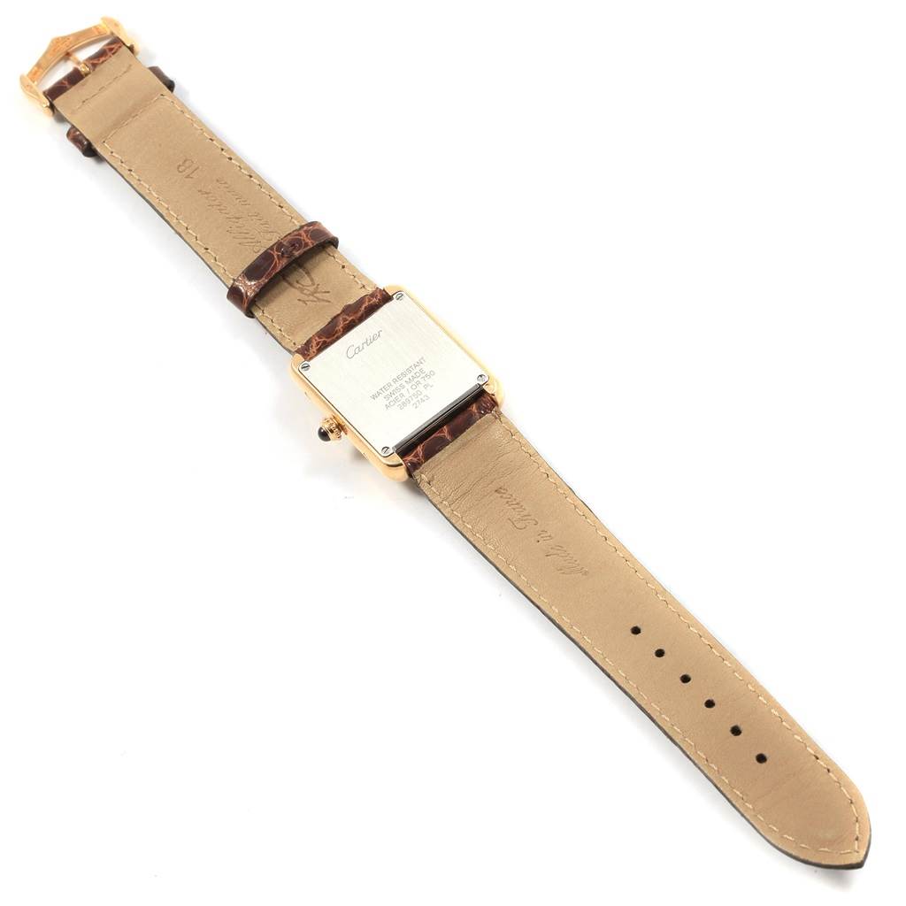 The image shows the back and leather strap of a Cartier Tank Solo W1018755 Women's Steel and Gold (two tone) Silver Dial W1018755 Women's Steel and Gold (two tone) Silver Dial watch, showcasing its case back and buckle.