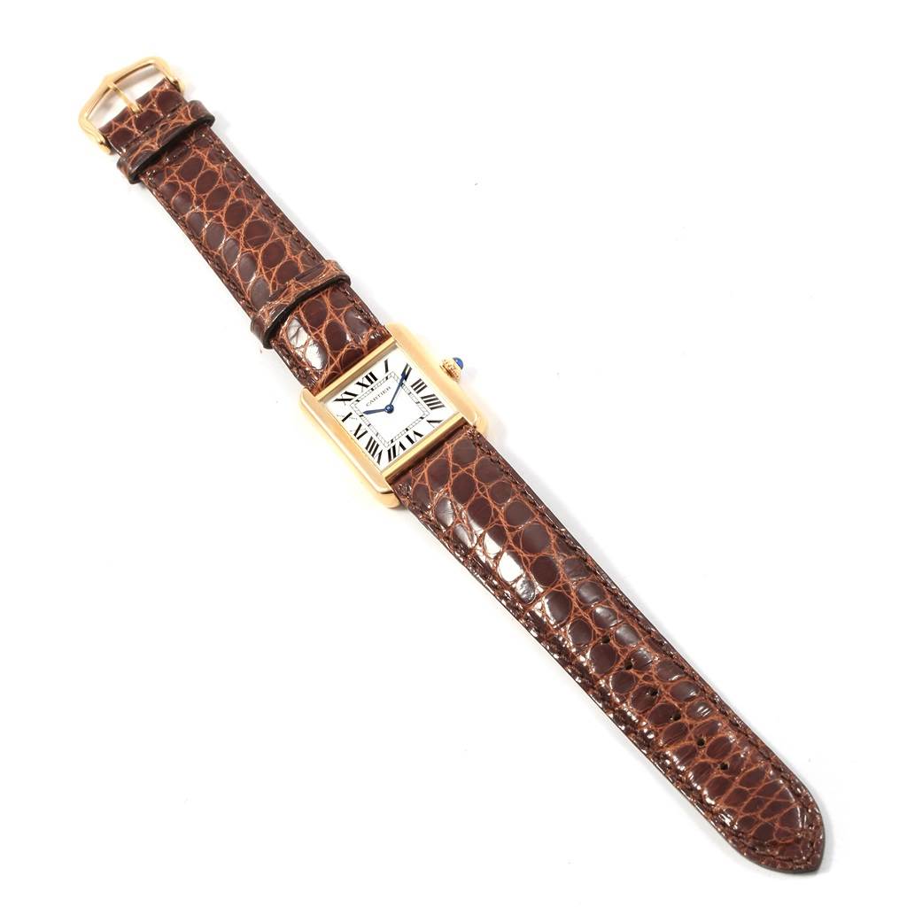 The image shows a Cartier Tank Solo W1018755 Women's Steel and Gold (two tone) Silver Dial W1018755 Women's Steel and Gold (two tone) Silver Dial watch with a brown leather strap, viewed from a top-down angle.