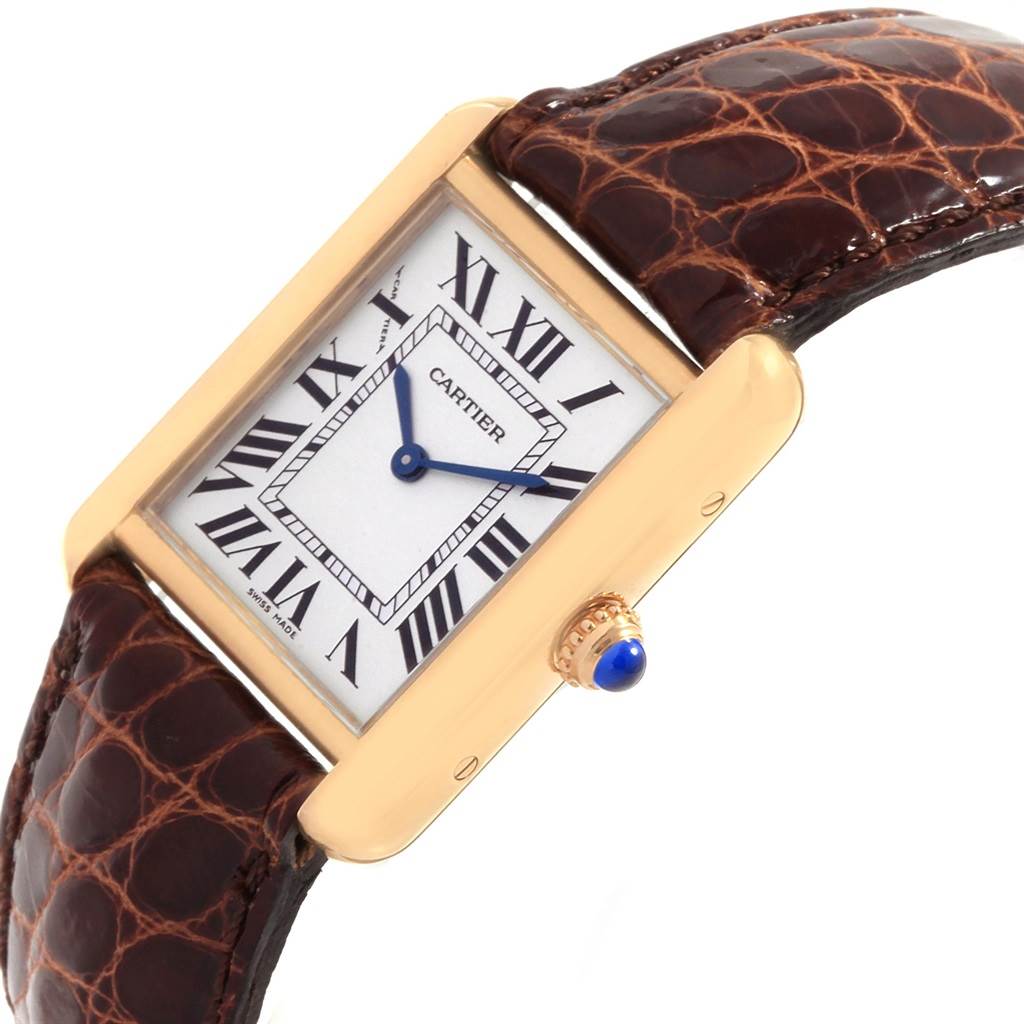This is an angled view of the Cartier Tank Solo W1018755 Women's Steel and Gold (two tone) Silver Dial W1018755 Women's Steel and Gold (two tone) Silver Dial watch, showing the face, Roman numerals, and brown leather strap.