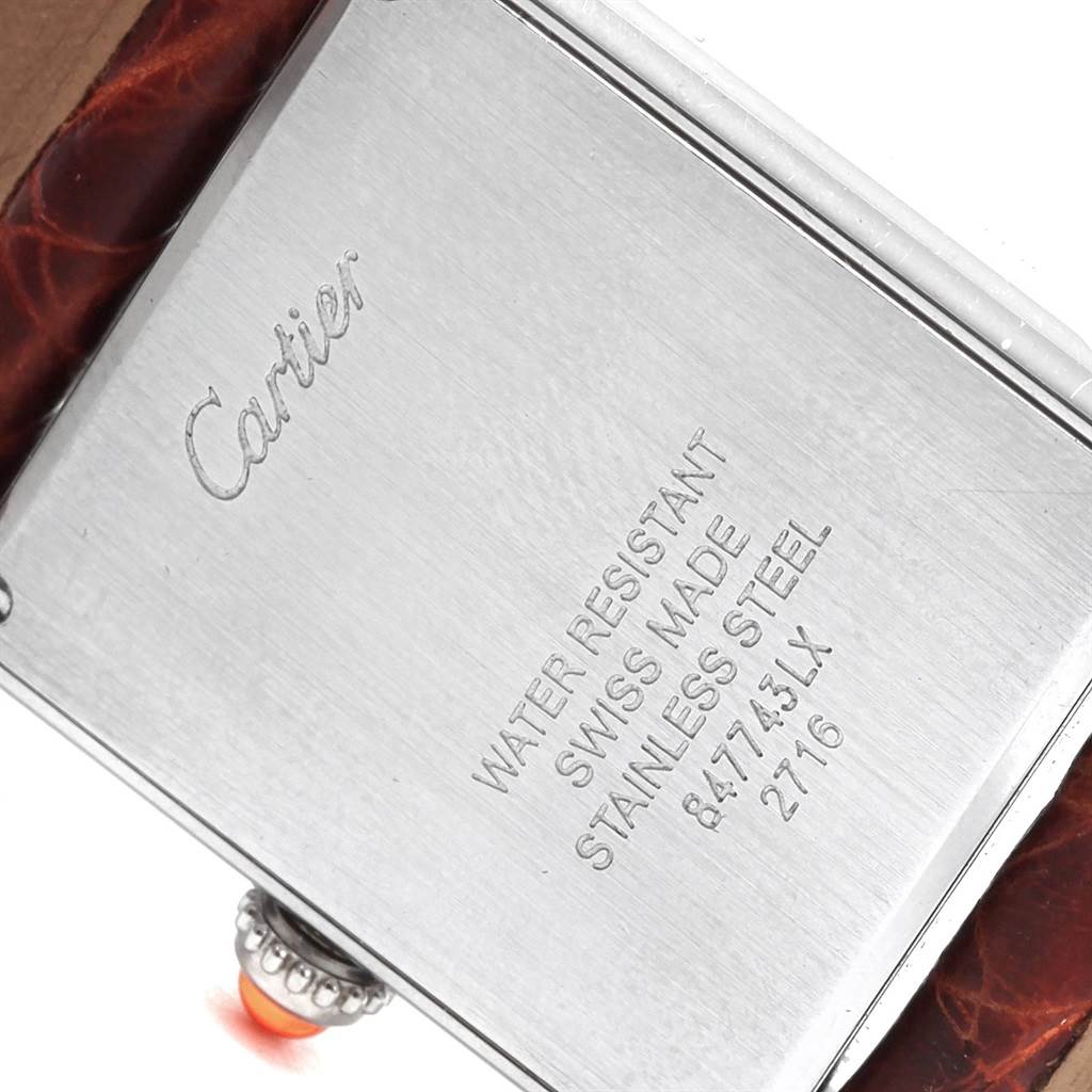 The image shows the back case and part of the strap of a Cartier Tank Solo W1019455 Women's Stainless Steel Orange Dial W1019455 Women's Stainless Steel Orange Dial watch.