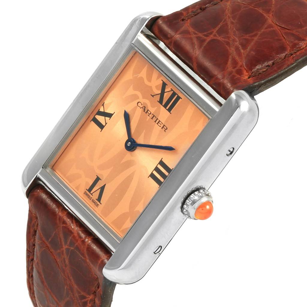 The Cartier Tank Solo W1019455 Women's Stainless Steel Orange Dial W1019455 Women's Stainless Steel Orange Dial watch is shown at a slight angle, highlighting the dial, Roman numerals, crown with cabochon, and leather strap.