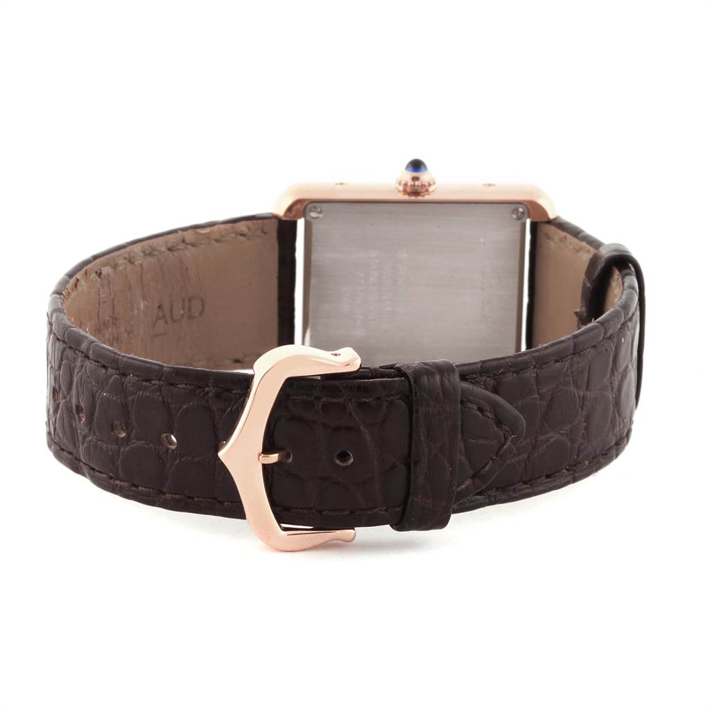 The image shows the back view of a Cartier Tank Solo W5200024 Women's Steel and Gold (two tone) Silver Dial W5200024 Women's Steel and Gold (two tone) Silver Dial watch with a focus on the leather strap and clasp.