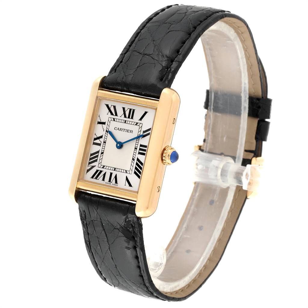 The image shows a Tank Solo model by Cartier from an angled side view, highlighting the face, gold casing, crown, and black leather strap.