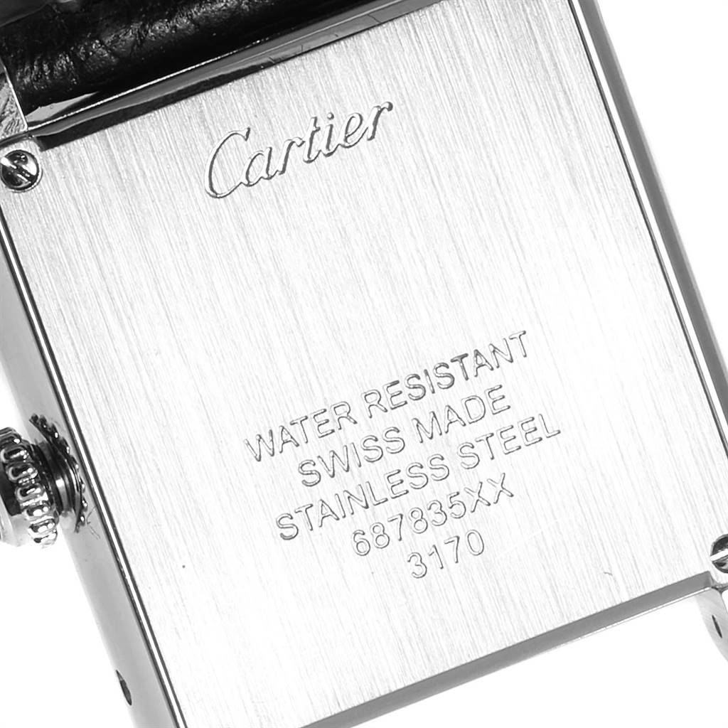 This image shows the back case of a Cartier Tank Solo W1018255 Women's Stainless Steel Silver Dial W1018255 Women's Stainless Steel Silver Dial watch, displaying its brand engravings and some technical details.