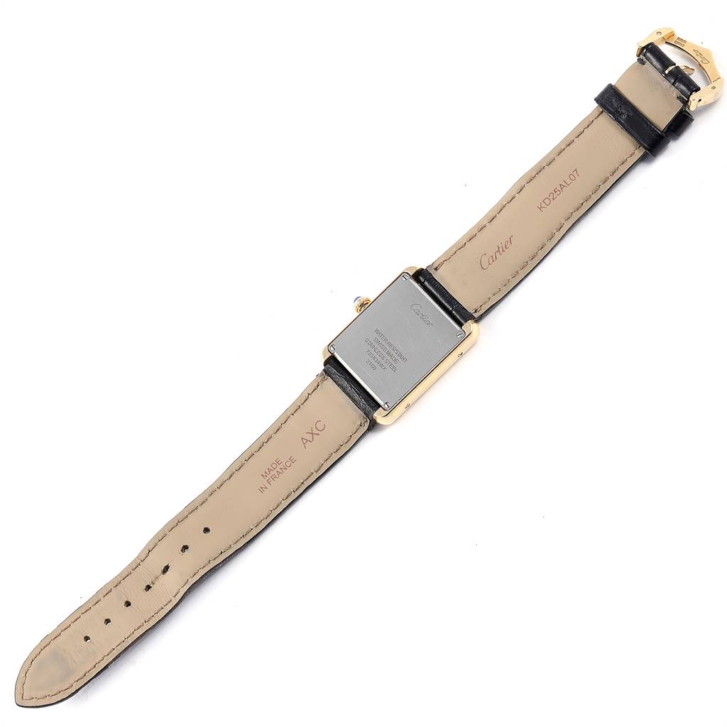 The image shows the back view of a Cartier Tank Solo W1018755 Women
s Steel and Gold (two tone) Silver Dial W1018755 Women
s Steel and Gold (two tone) Silver Dial watch, highlighting the back case, leather strap, and buckle.