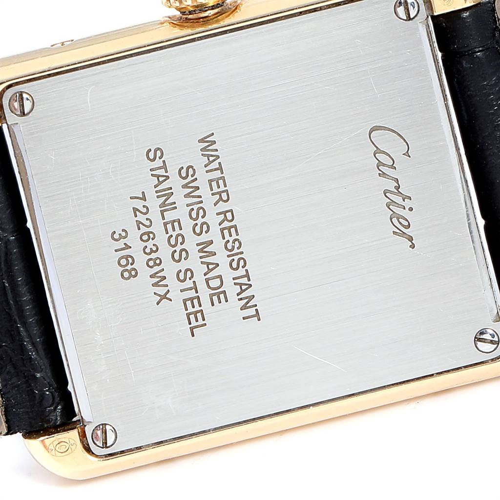 The image shows the engraved backplate of a Cartier Tank Solo W1018755 Women
s Steel and Gold (two tone) Silver Dial W1018755 Women
s Steel and Gold (two tone) Silver Dial watch, highlighting its water resistance and stainless steel composition.