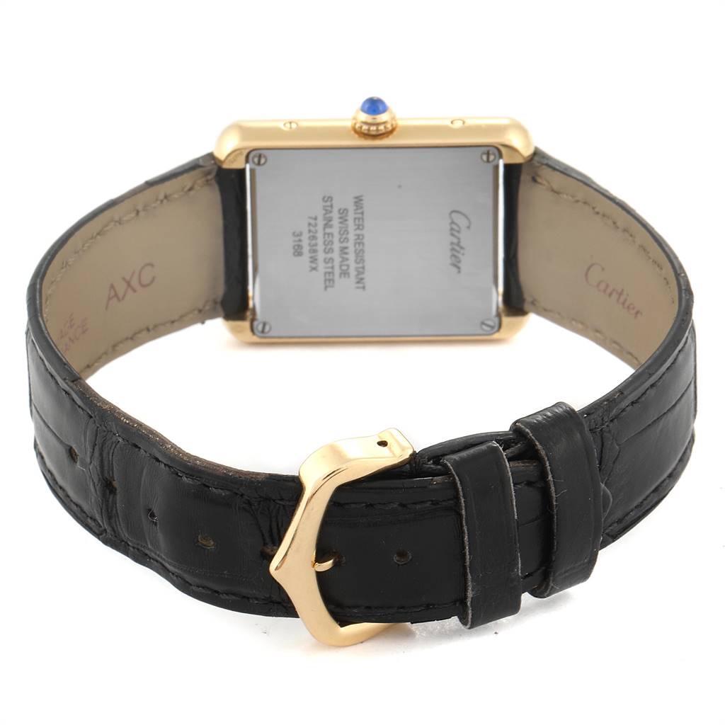 The image shows the back view of a Cartier Tank Solo W1018755 Women
s Steel and Gold (two tone) Silver Dial W1018755 Women
s Steel and Gold (two tone) Silver Dial watch, including its leather strap and buckle.