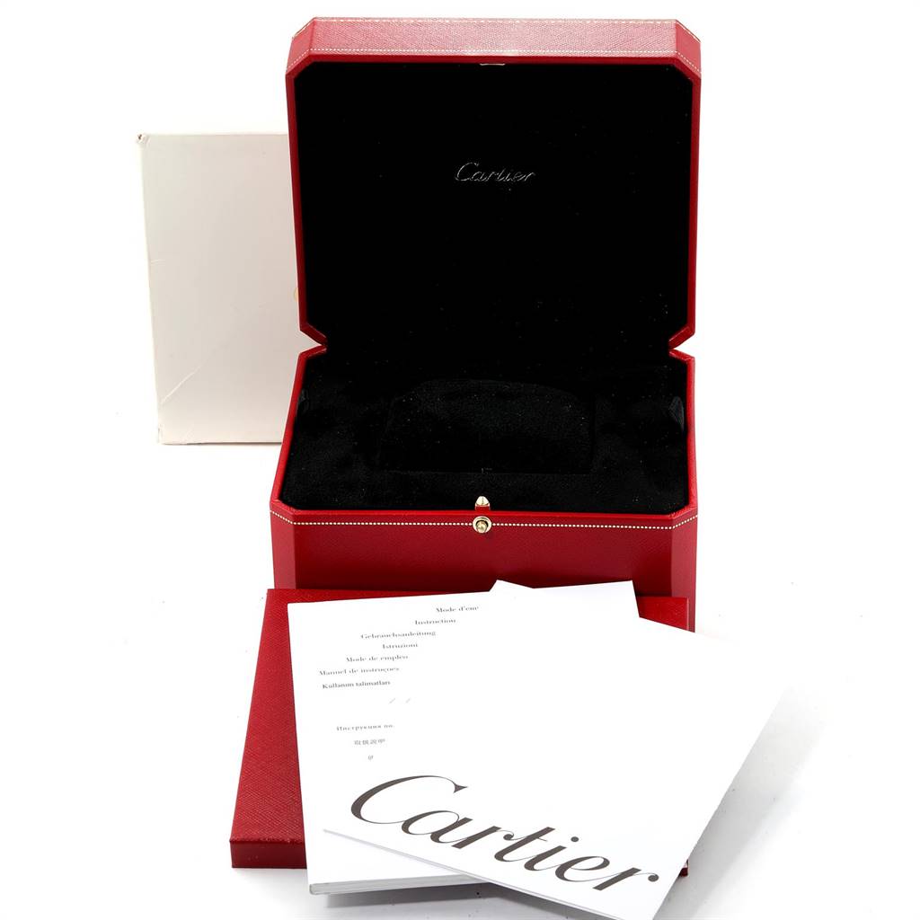 This image shows the Cartier Tank Solo W5200024 Women's Steel and Gold (two tone) Silver Dial W5200024 Women's Steel and Gold (two tone) Silver Dial watch box and accompanying documents from a front angle.