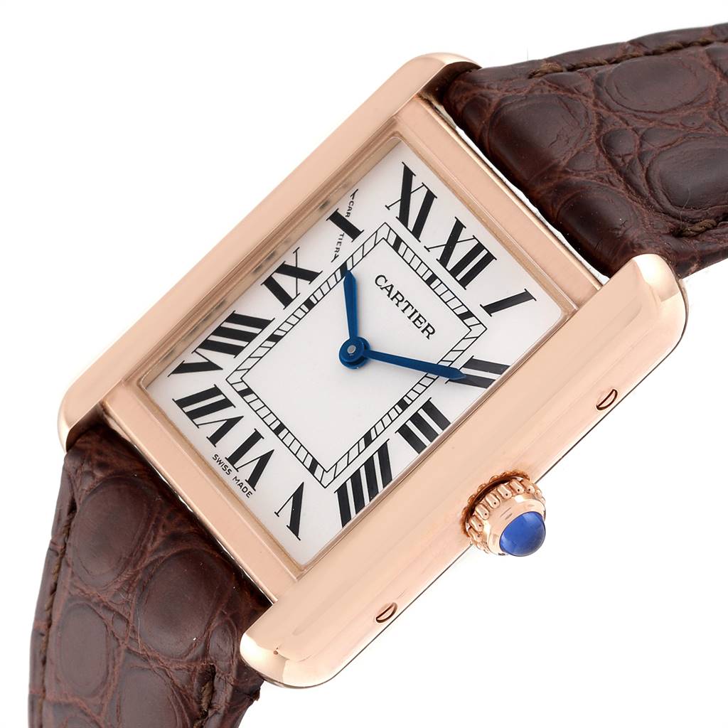 The image displays a Cartier Tank Solo W5200024 Women's Steel and Gold (two tone) Silver Dial W5200024 Women's Steel and Gold (two tone) Silver Dial watch at an angle showing its face, crown, and part of its leather strap.