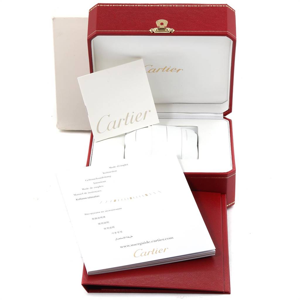 The image shows the packaging and manuals for a Cartier Tank Solo W5200013 Women
s Stainless Steel Silver Dial W5200013 Women
s Stainless Steel Silver Dial watch, with the watch box open and booklets displayed.