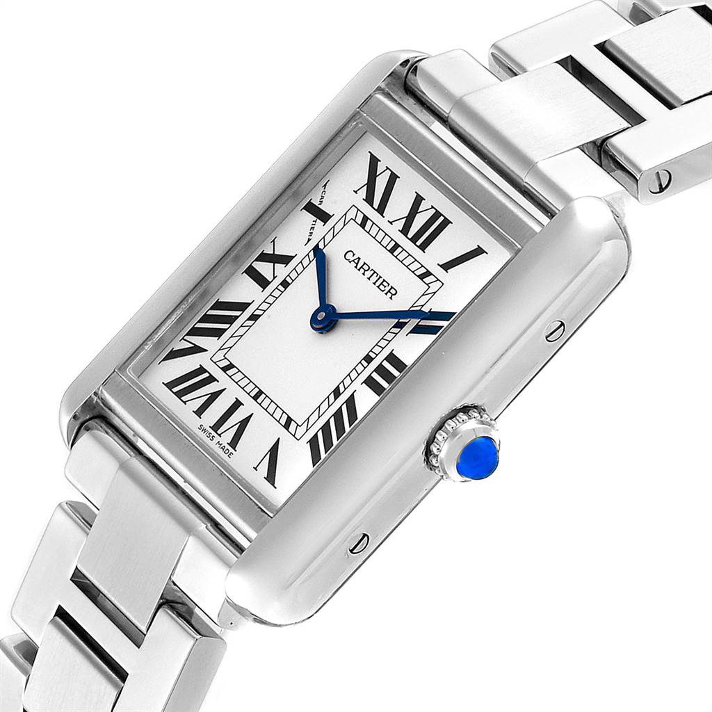 This image shows a close-up of the Cartier Tank Solo W5200013 Women
s Stainless Steel Silver Dial W5200013 Women
s Stainless Steel Silver Dial watch face and part of the metal bracelet at an angle, highlighting details like the crown with a blue gemstone.