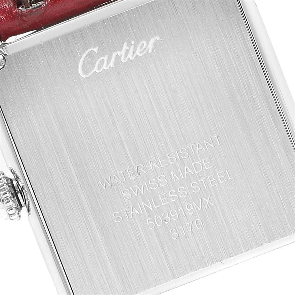 This image shows the back case of a Cartier Tank Solo W5200000 Women's Stainless Steel Pink Dial W5200000 Women's Stainless Steel Pink Dial watch, displaying engravings and part of the strap.
