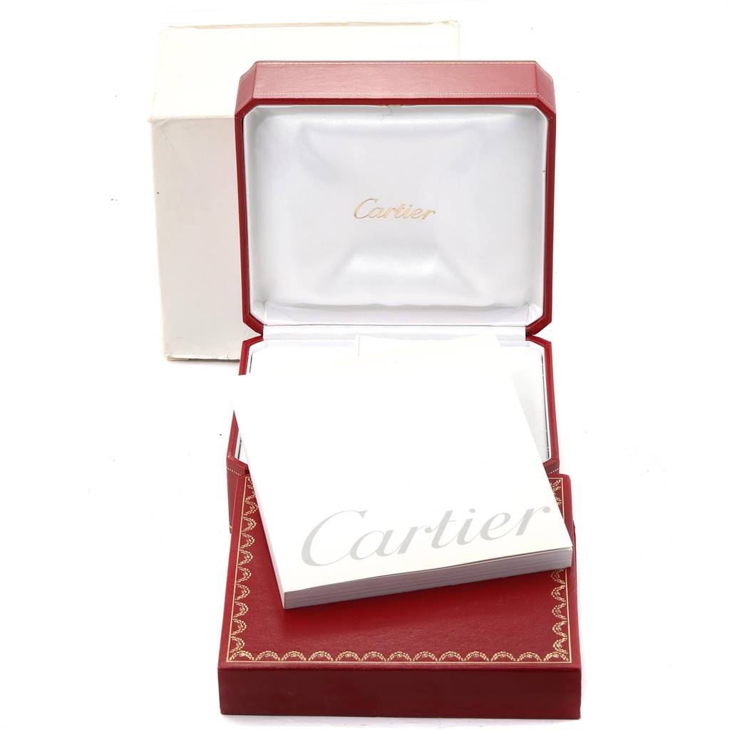 The image shows the open red Cartier watch box and papers for the Tank Solo model, viewed from the front.