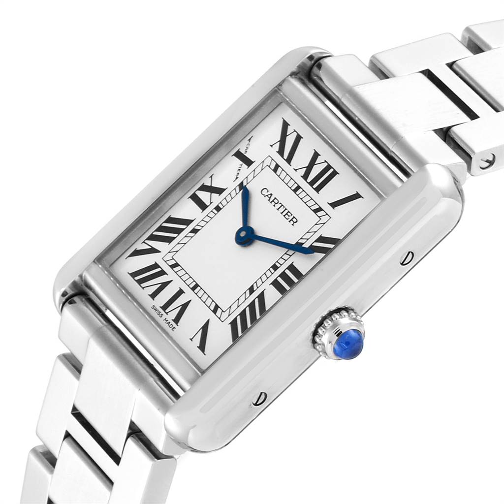 The image shows a tilted view of the Cartier Tank Solo W5200013 Women
s Stainless Steel Silver Dial W5200013 Women
s Stainless Steel Silver Dial watch, highlighting its rectangular face, Roman numerals, blue hands, and metal bracelet.